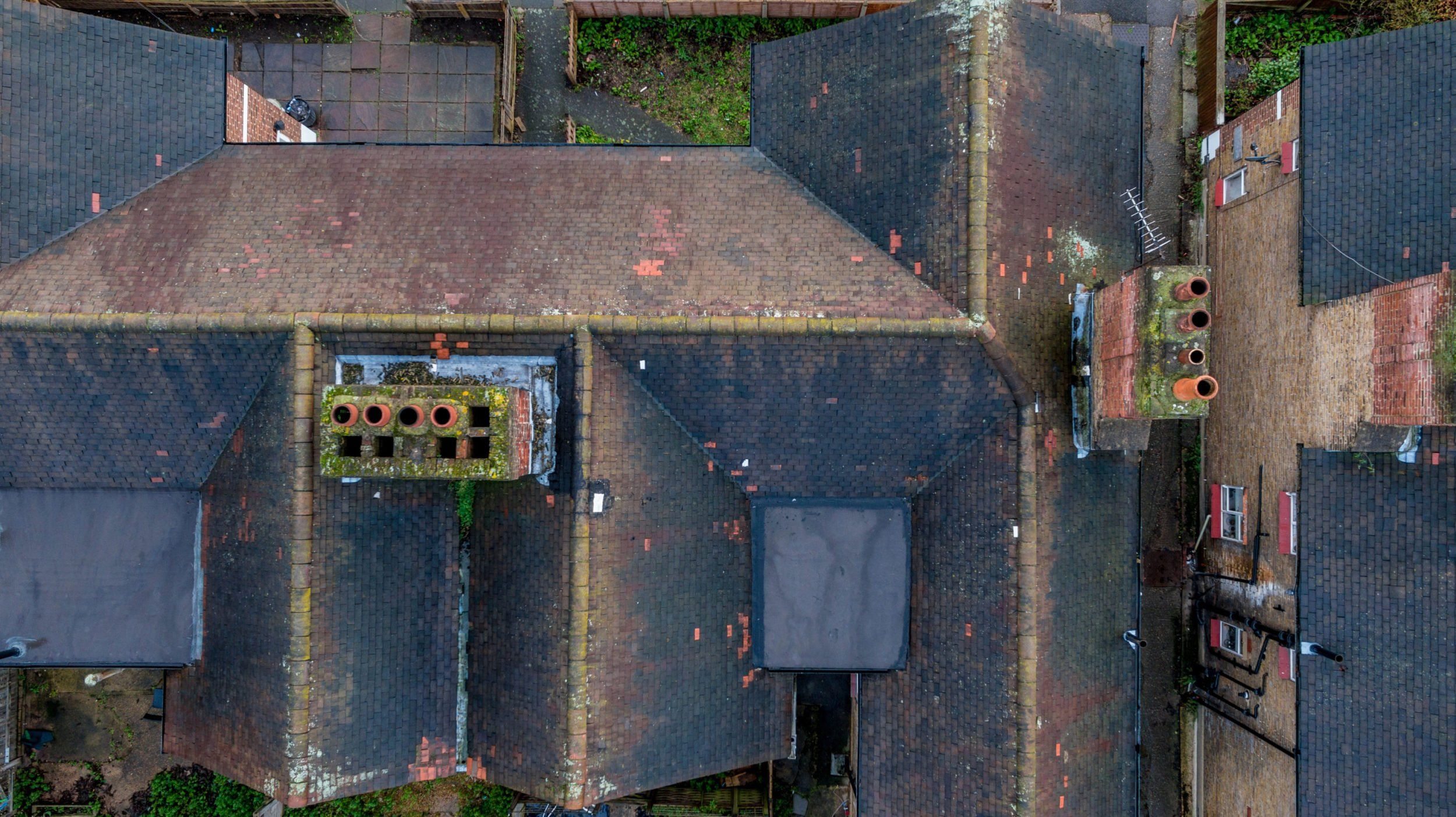 Drone flying over a UK residential property for aerial roof inspection